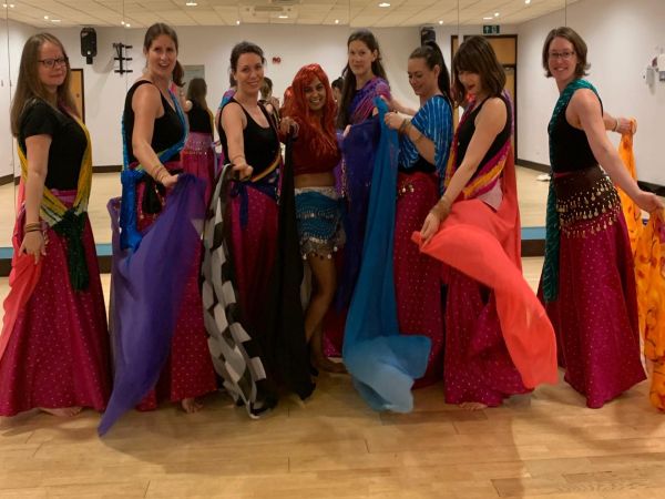 Happy hens celebrating at belly dance hen party Glasgow with professional instructor