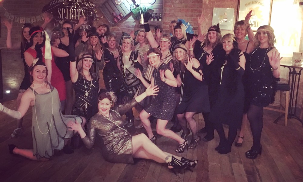 Group of women in 1920s flapper costume enjoying Charleston hen party dance class at Glasgow Dance Centre studio
