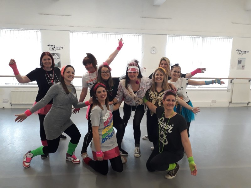 Group celebrating at ABBA themed hen party dance class Glasgow